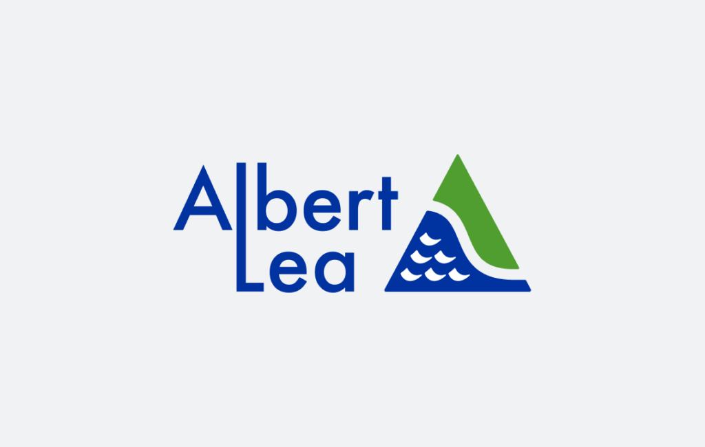 Logo of Albert Lea with stylized green triangle and blue wave pattern.