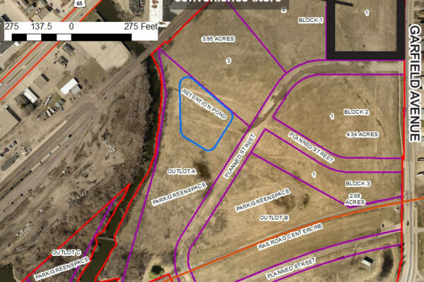 Aerial map showing parcels of land at Blazing Star Landing, with labeled blocks, outlined sections, and a marked site for a proposed convenience store.