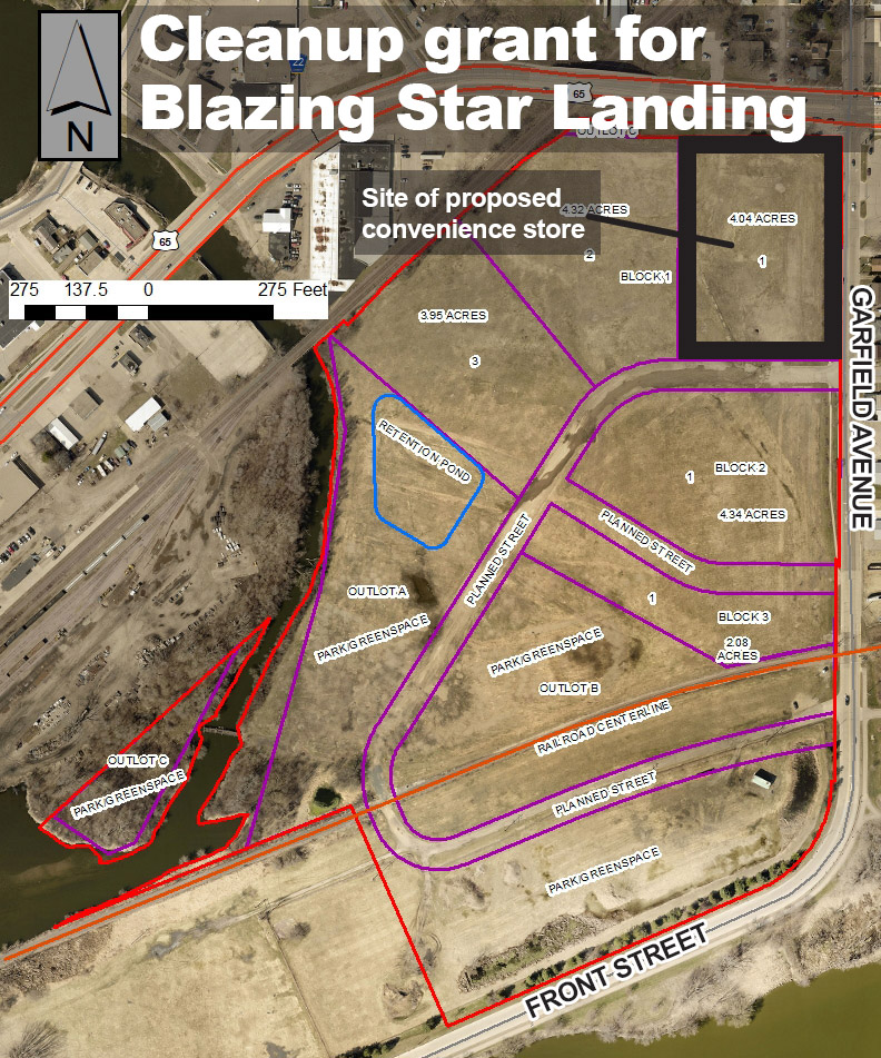 Aerial map showing parcels of land at Blazing Star Landing, with labeled blocks, outlined sections, and a marked site for a proposed convenience store.