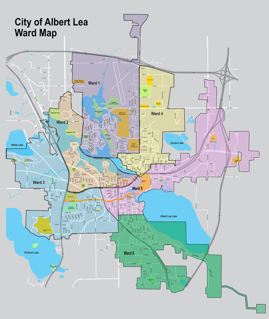 Map of Albert Lea city wards, showing six distinct colored areas labeled Wards 1 to 6, with roads, lakes, and notable geographic features marked.