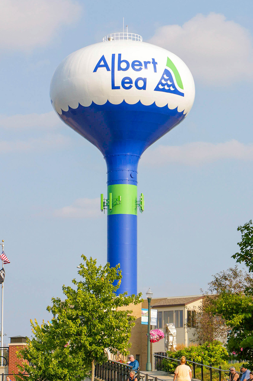 A tall blue and white water tower with 