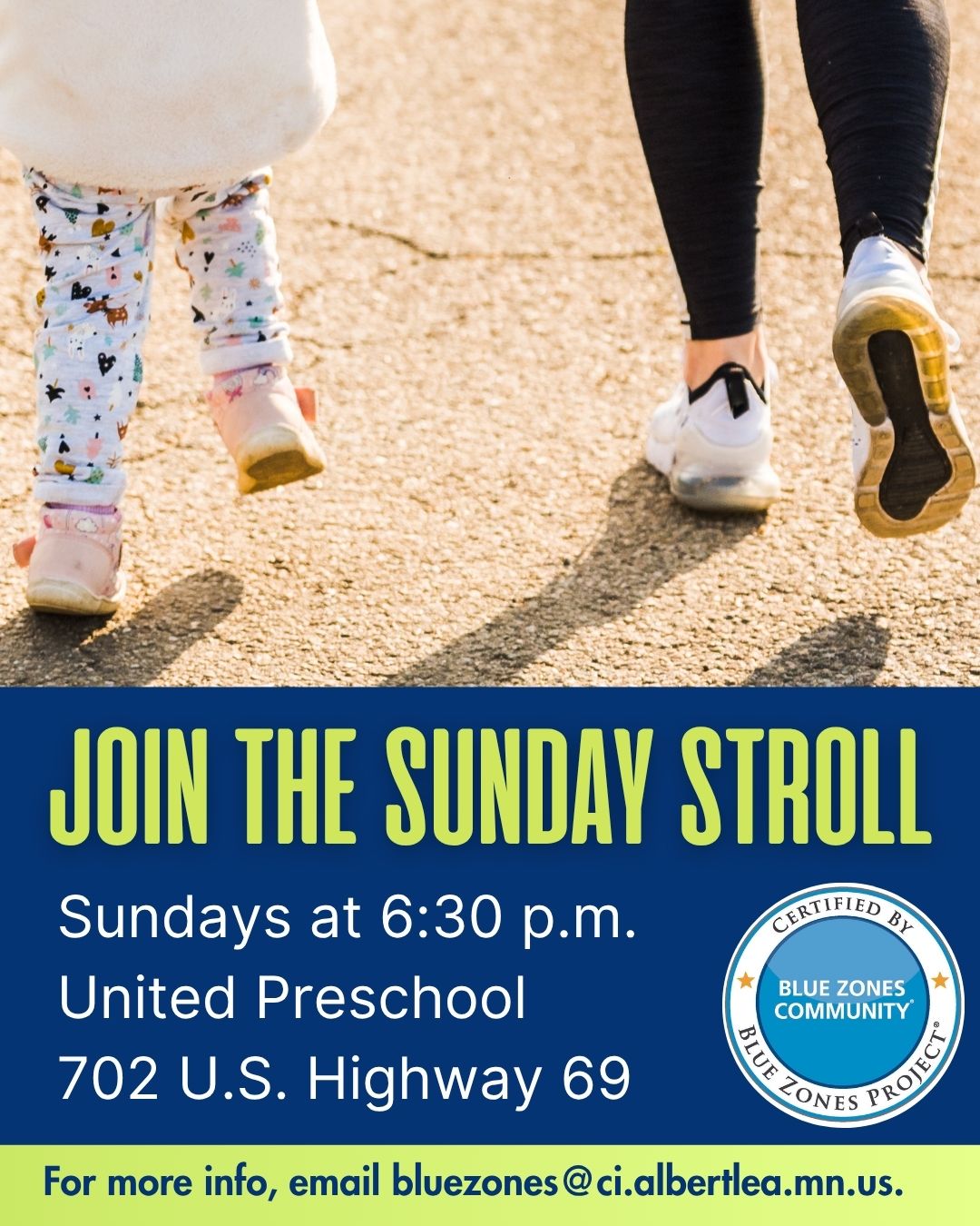 An image shows an adult and a young child walking away from the camera, their legs and feet visible. The adult is on the right, wearing dark pants and white sneakers with blue accents. The child is on the left, wearing light-colored pants with patterns and pink shoes. The ground is a light-colored asphalt or paved surface, with sunlight creating shadows. Below them, a dark blue banner reads
